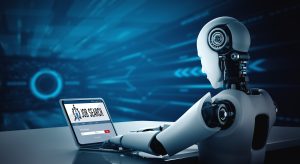Image description: A futuristic robot sits at a desk, diligently working on a laptop. The laptop screen displays the words 'job search.' In the foreground, a translucent blue layer adds a touch of futuristic technology to the scene.
